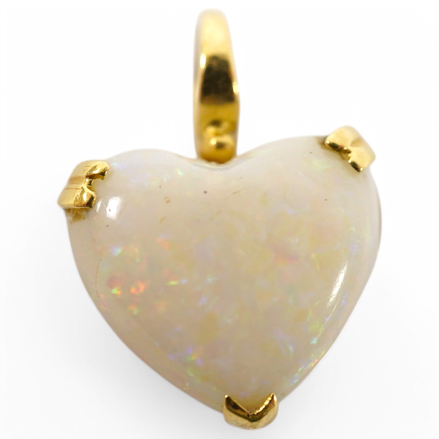 A modern 18ct gold mounted heart shaped white opal pendant, overall 20mm, gross weight 3.2 grams. Condition - fair to good